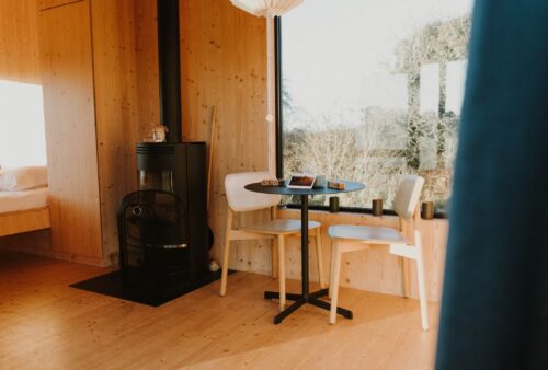 Thumbnail of http://chairs,%20table%20and%20stove%20in%20a%20cabin