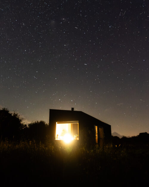 cabin with a starry night sky